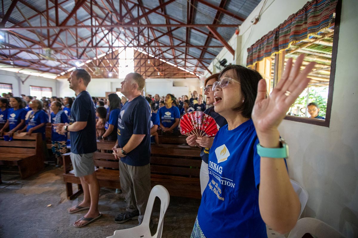 People worshipping during the Isnag Bible dedication.